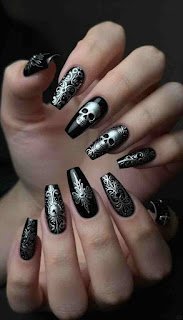 Classic gothic nail aesthetics featuring black and silver designs Classic gothic nail aesthetics featuring black and silver designs